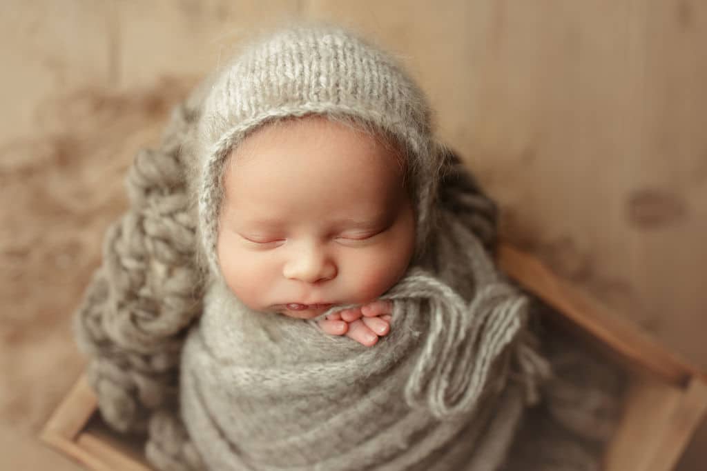 bundled up baby boy in Chicago studio