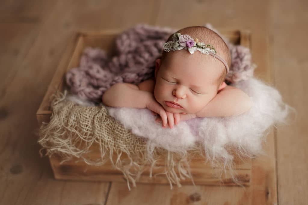 newborn baby girl in basket