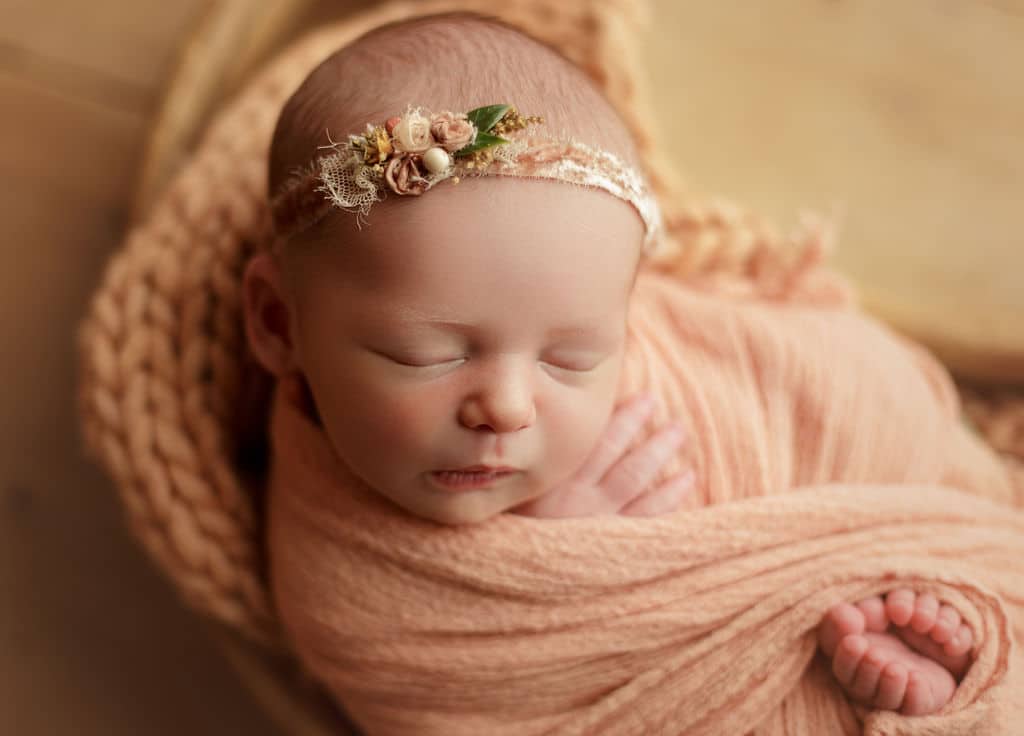 baby girl in wood moon prop