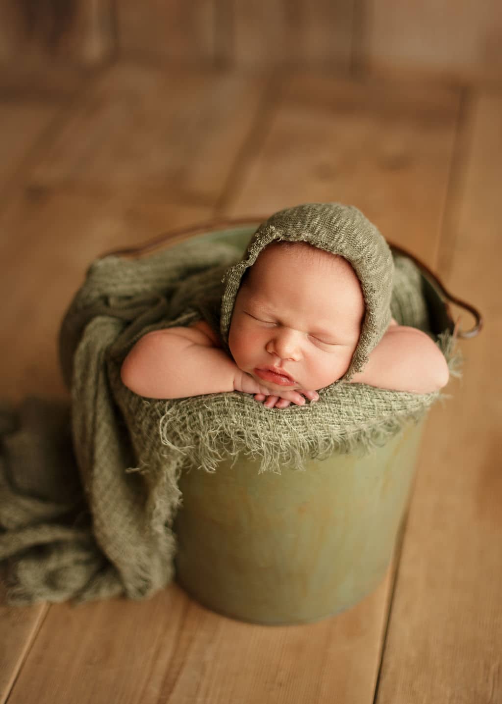 newborn baby in bucket