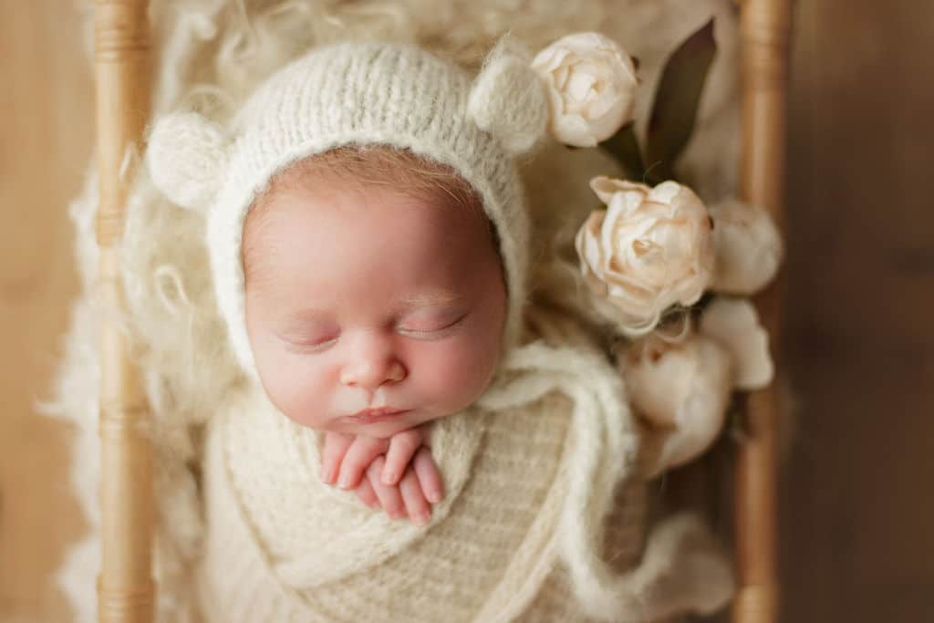 baby girl in bear hat
