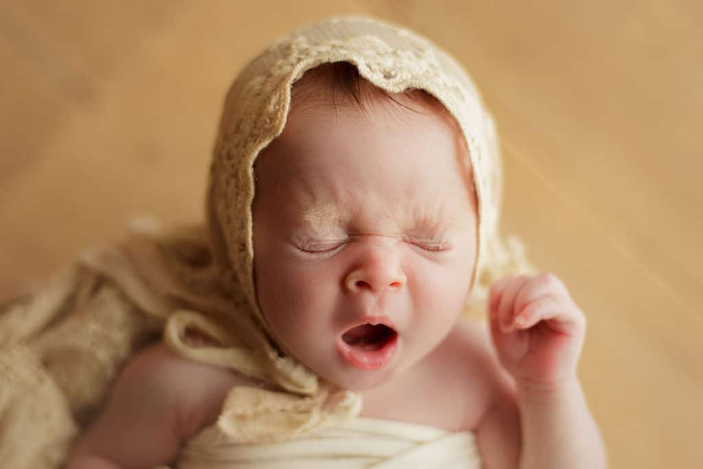 baby yawn with bonnet on