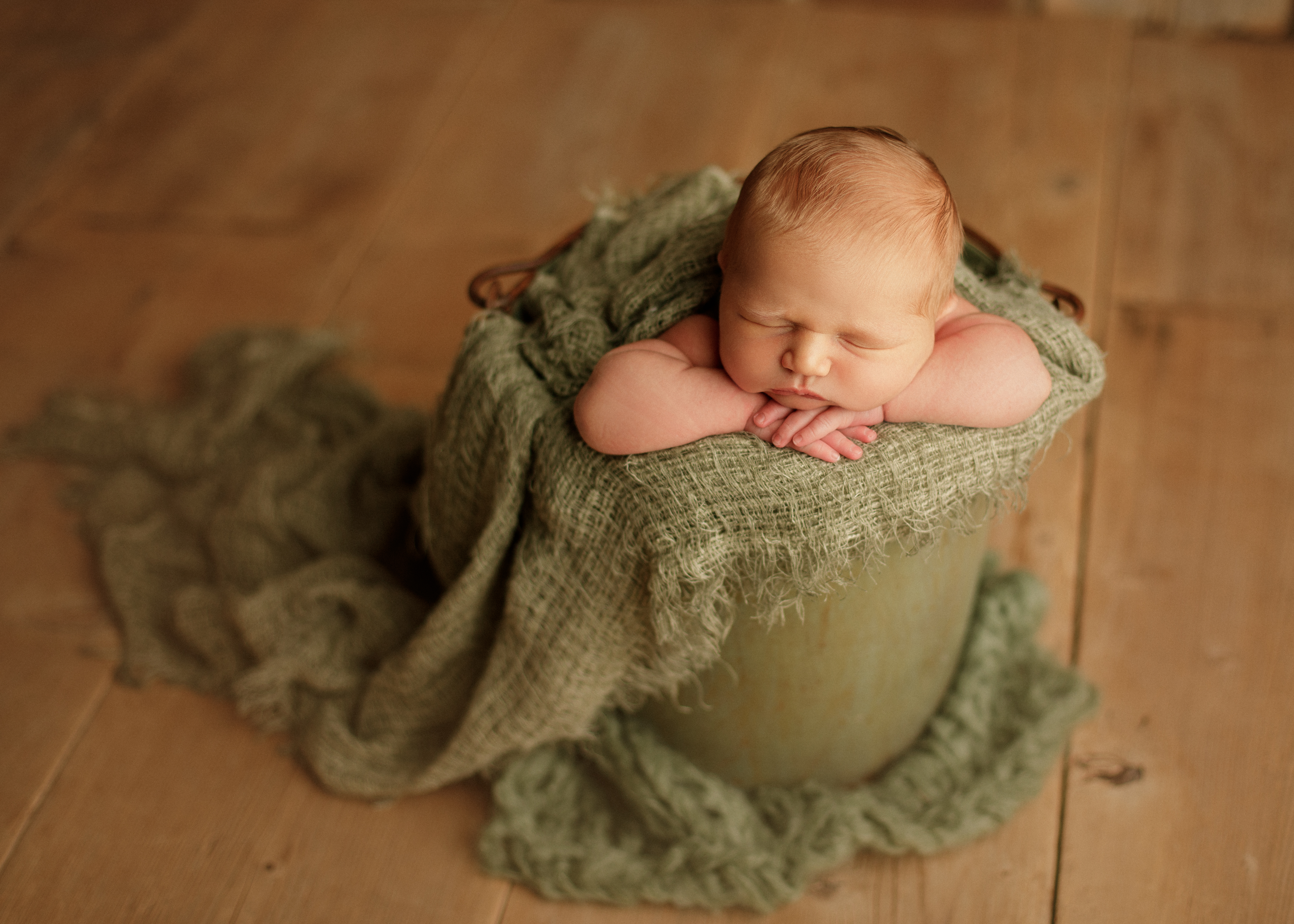 newborn baby boy in bucket