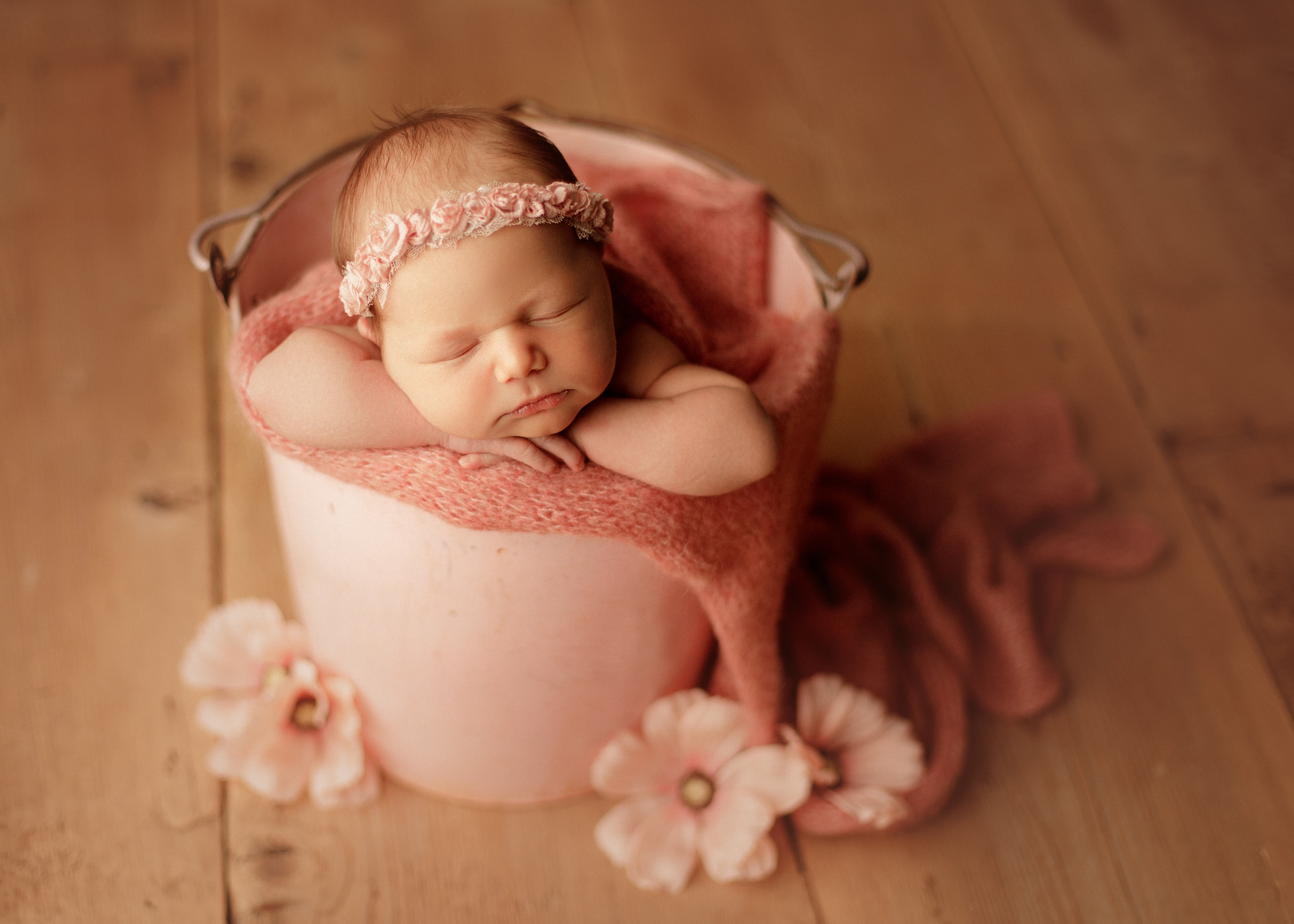 newborn baby in a bucket