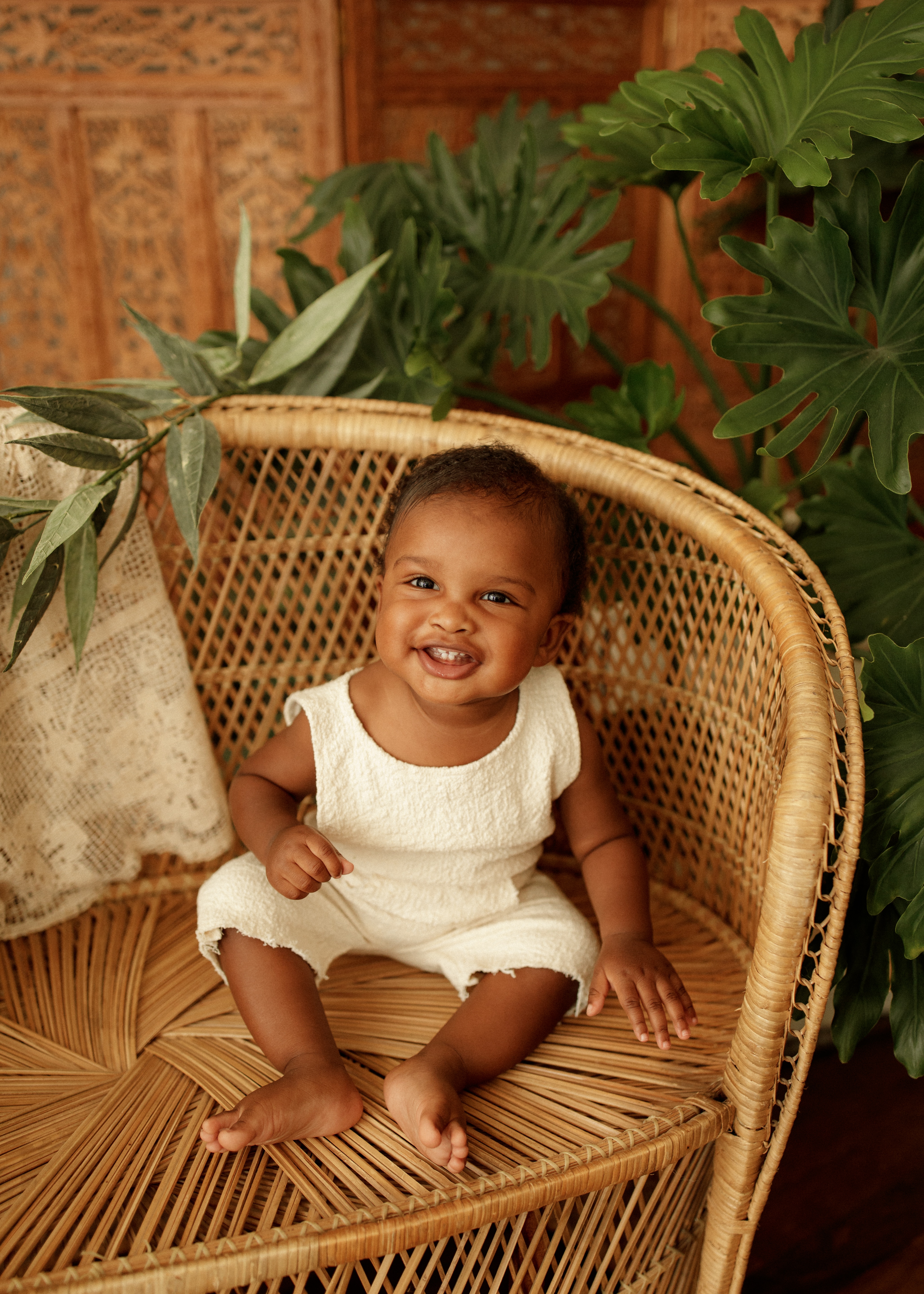 happy baby in boho baby photo shoot Chicago