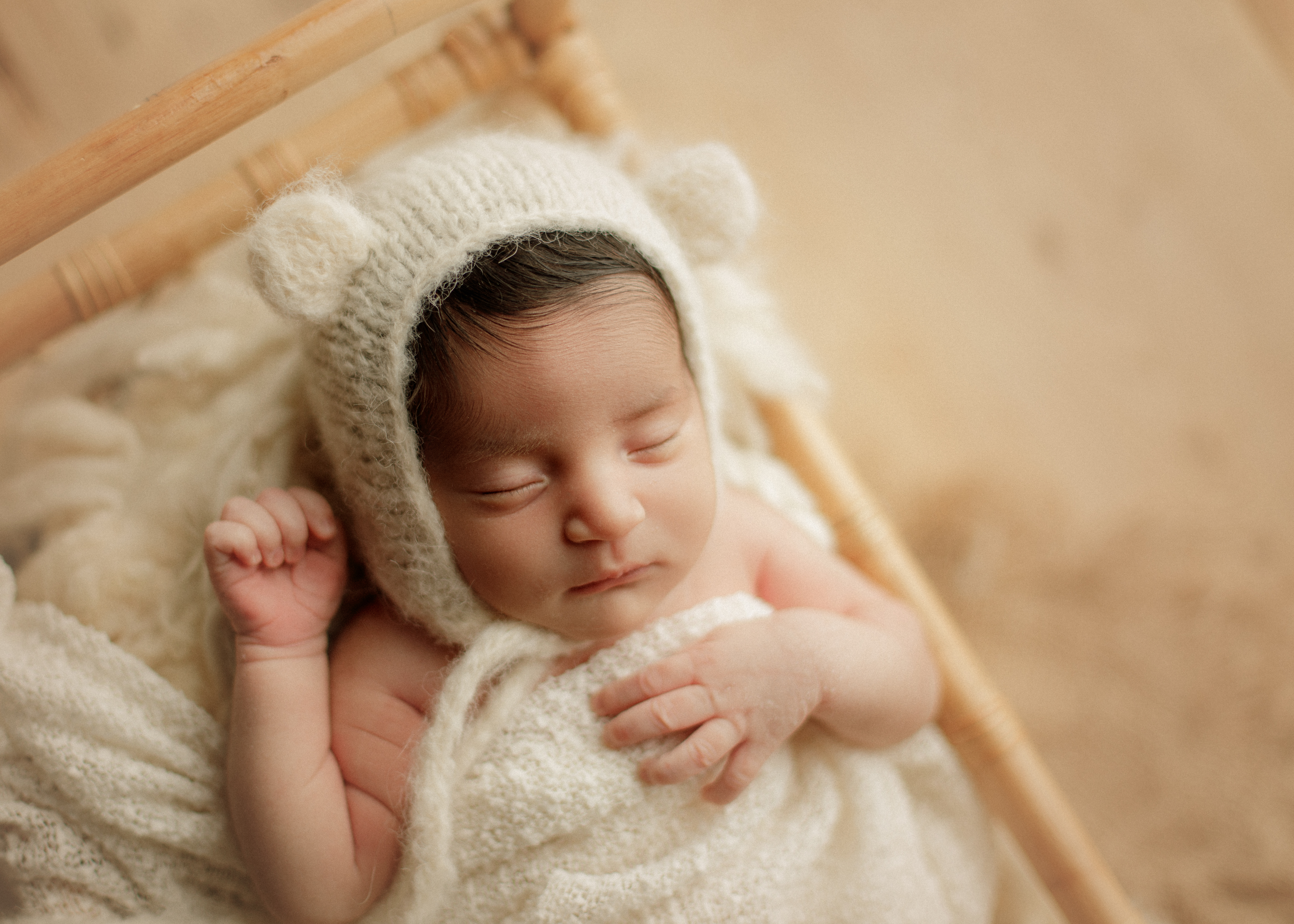 newborn baby girl in bear hat