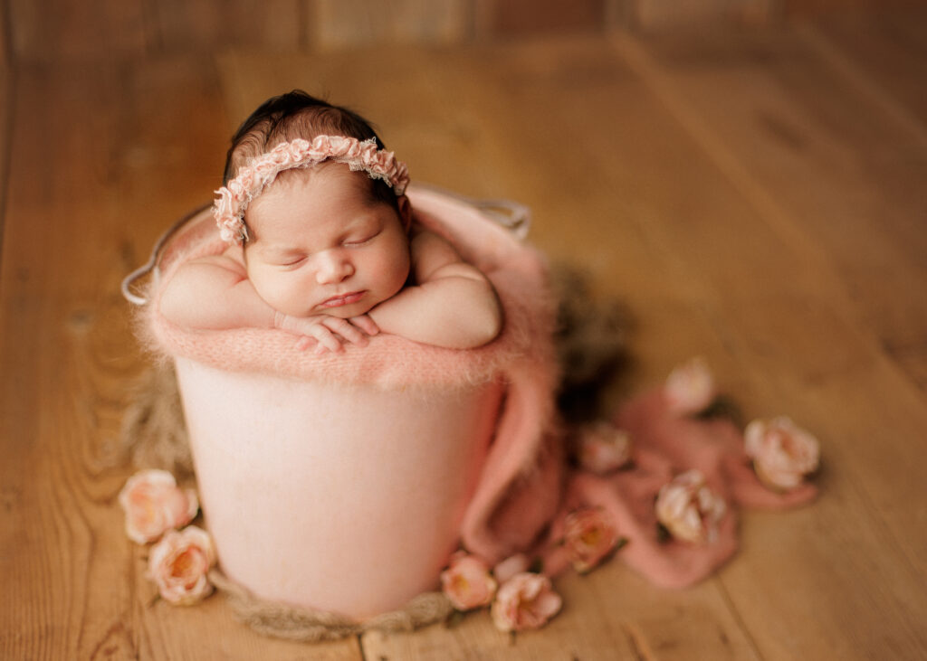 basket pose newborn photographer
